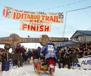 Libby Riddles crossing the Nome finish line in 1985. Image-Alaska Sports Hall
