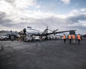 Donated salmon being loaded onto the Everts Air Cargo DC-6 at Ted Stevens Anchorage International Airport in 2021 Image-State of Alaska.