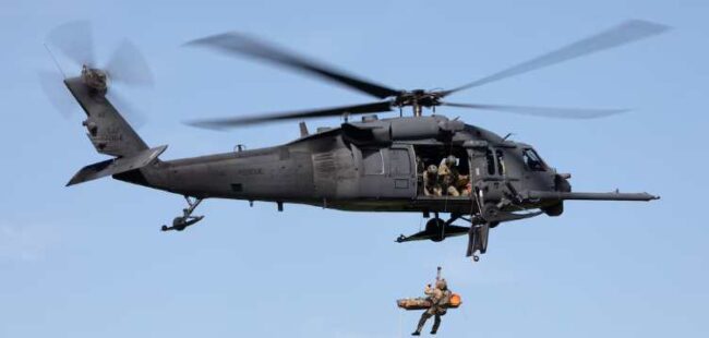 Alaska Air National Guard HH-60G Pave Hawk helicopter aviators assigned to the 210th Rescue Squadron hoist a 212th Rescue Squadron pararescueman and simulated casualty during a capabilities exercise over Malemute Drop Zone at Joint Base Elmendorf-Richardson, Alaska, June 25, 2024. Aircrew of 210th RQS and 212th Rescue Squadron Guardian Angels rescued four paddle boarders in distress Aug. 6, 2024, near Byers Lake. (Alaska National Guard photo by Alejandro Pena)