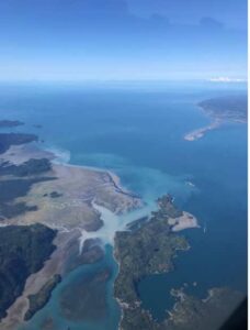 Photo by Martin Stuefer
Cloudy water from the Wosnesenski River enters Kachemak Bay across from the Homer Spit on Aug. 28, 2021. Sediment-laden runoff from the Wosnesenski Glacier forms a turbid plume as it spreads from the river mouth into the bay.