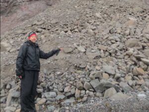 Photo by Rich Kleinleder
Ned Rozell pauses at the site of a rock avalanche on St. Matthew Island in the Bering Sea during a 2012 visit.