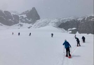 Photo by Hannah Mode
Girls* on Ice participants snowshoe on the Gulkana Glacier in 2023. Photo by Hannah Mode.