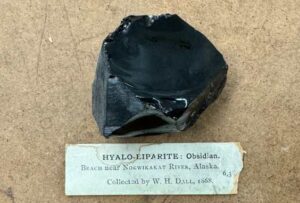 Photo by Jeff Rasic
A piece of obsidian rock sits on display in the Smithsonian Institution in Washington, D.C. William Healey Dall collected the rock in 1868 near the Nowitna River in Interior Alaska.