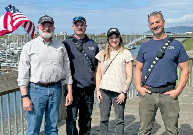 Left to right: Homer Port Director Bryan Hawkins, Deputy Harbormaster Aaron Glidden, Alaska Sea Grant State Fellow Biz Wallace, and Harbormaster Matt Clarke meet as part of the Alaska Clean Harbors program, June 25, 2024. Photo courtesy Biz Wallace.