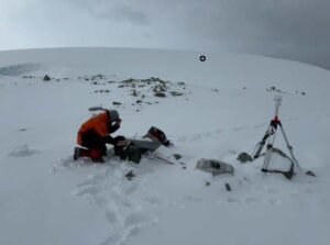 Photo courtesy of the Wilson Alaska Technical Center.
A field engineer of the Wilson Alaska Technical Center at the UAF Geophysical Institute services a portable infrasound monitoring station near Palmer Station, Antarctica.