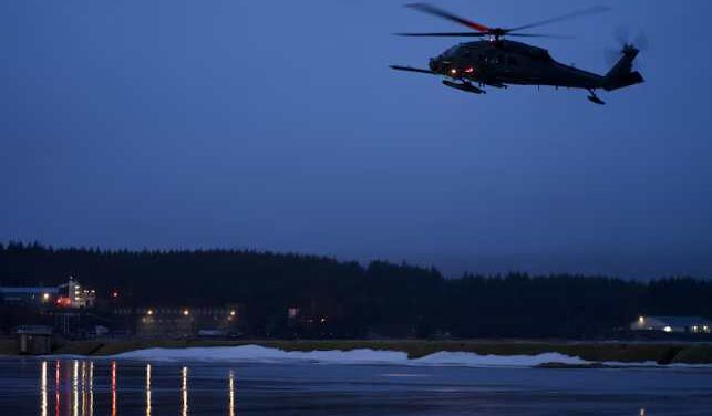 Alaska Air National Guardsmen conduct a medical evacuation at night