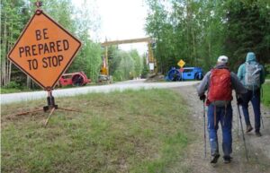 Photo by Ned Rozell. Bruno Grunau, left, and Forest Wagner approach the entryway to Chena Hot Springs Resort and the conclusion of their 50-mile, 33-hour foot journey from Eagle Summit.
