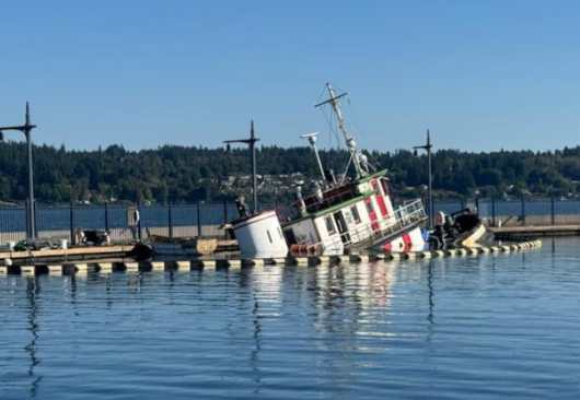 Unified command established in response to tug sinking in Bremerton Marina A tug begins to sink near in the Bremerton Marina, near Bremerton, Washington, Sept. 17, 2025, causing pollution. Coast Guard Sector Puget Sound received an initial pollution report from the National Response Center regarding the vessel Dominion, a 130-foot tugboat, sinking and leaking fuel and oil within the marina. (Photo Courtesy of the Washington Department of Ecology)