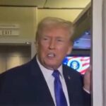Trump talking to reporters on Air Force 1. Image-X video screengrab