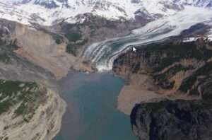 The debris field from the October 2015 landslide extends over the toe of the Tyndall Glacier and into the Tann Fiord in Spring 2016. Photo by Chris Larsen