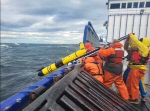 Photo by Jared Weems
Scientists aboard the patrol vessel Stimson launch the glider Shackleton in May 2024 to search for tagged juvenile crabs in Bristol Bay.