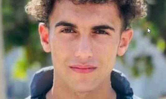 Journalist Hassan Hamad holds a photo of Ismael al-Ghoul and Rami al-Rifi, Palestinian reporters also killed by Israel in Gaza. (Photo: Maha Hussaini/X) ‘We’ll Come for You Next’: Israel Threatened to Kill Teen Journalist in Gaza—Then Did