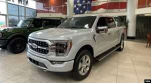 A Ford F-150 truck on display in the showroom at Suburban Ford of Sterling Heights in Michigan, February 28, 2024.