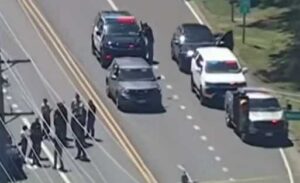Police cars arrive at the scene of a shooting by a US Immigration and Customs Enforcement (ICE) agent in Stafford Township, New Jersey on June 15, 2026. (Screenshot from ABC 7 New York)
