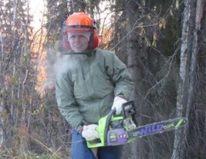 Photo courtesy of Glen Holt
Wearing protective equipment while chainsawing, as this person is, and getting the most from your firewood will be discussed by retired forester Glen Holt this month.