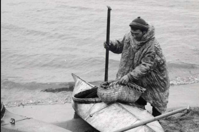 Native Alaskan Yup'ik Eskimo and kayak. Credit: Fish and Wildlife Service/E.P. Haddon.
