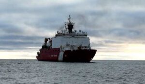 The U.S. Coast Guard Cutter Healy (WAGB 20) maneuvers off the coast of Nome, Alaska, following the completion of the first phase of their Fall 2024 deployment. U.S. Coast Guard photo by Senior Chief Petty Officer Matt Masaschi.