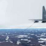 JOINT BASE ELMENDORF-RICHARDSON, Alaska – A 211th Rescue Squadron HC-130J Combat King II refuels a 210th Rescue Squadron HH-60G Pave Hawk during training at JBER March 23, 2020. The Pave Hawk required refueling during a March 30, 2024, mission to rescue two snowmachine riders. (U.S. Army National Guard photo by Spc. Grace Nechanicky)