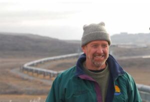 Photo by Øivind Tøien
Brian Barnes listens to a colleague while studying ground squirrels near the trans-Alaska pipeline north of the Brooks Range on Sept. 21, 2007.