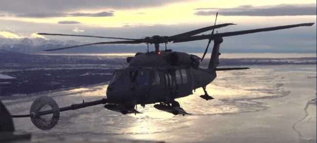 A 211th Rescue Squadron HC-130J Combat King II refuels a 210th Rescue Squadron HH-60G Pave Hawk during training over Alaska Jan. 11, 2021. A 210th RQS Pave Hawk carried out two medical evacuation missions April 4 and 5, 2024, one of them with a 211th RQS HC-130, and both with 212th Rescue Squadron Guardian Angels. (Alaska Air National Guard photo by Staff Sgt. Kelly Willett)