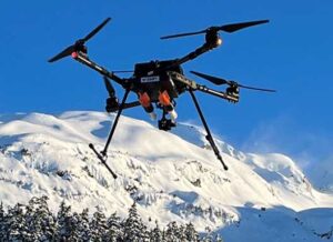 The Alaska DOT and Alaska Railroad in January successfully tested Drone Amplified’s AltaX Drone with the Drone Avalanche Reduction Technology (DART). Here, the unit is shown carrying two inert rounds.
Drone Amplified/Alaska Railroad Corp./Alaska DOT