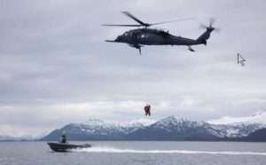 Alaska Air National Guard HH-60G Pave Hawk helicopter aviators assigned to the 210th Rescue Squadron hoist two 212th Rescue Squadron pararescuemen during underway hoist training in the Prince William Sound near Whittier. (Alaska National Guard photo by Alejandro Peña)