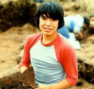 Photo: Daryl Squartsoff holds a Russian era iron axe head, Karluk, 1984.
