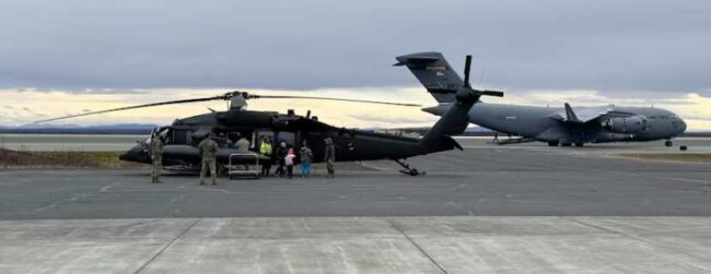 Alaska Air National Guard C-17 Globemaster III aircrew, assigned to the 176th Wing, work with Alaska Army National Guard UH-60L aircrew, with the 207th Aviation Troop Command, to evacuate approximately 300 displaced western Alaska residents from Bethel, Alaska, following Typhoon Halong, Oct. 15, 2025. The State Emergency Operations Center and the Alaska Organized Militia continue to coordinate response operations following the severe storm that struck Alaska’s West Coast. (Courtesy photo)