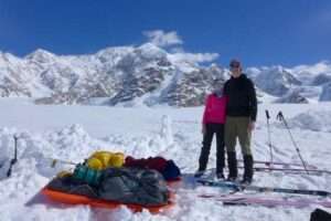 Photo courtesy of Peter Haeussler
Kara Haeussler and her father Peter pose in front of the Kahiltna Peaks and Denali on June 3, 2014, at the conclusion of a trip during which they climbed mountains and collected rock samples.