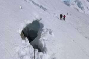 Photo by Peter Haeussler Peter Haeussler emerged from this hole in the Kahiltna Glacier after falling into a crevasse during a rock-gathering mission in 2014.