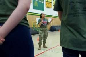 Alaska Air National Guard 1st Lt. Laurel
Foster, 176th Force Support Squadron Force Development and Education officer, speaks with
Service High School Navy Junior ROTC cadets. (Alaska Air National Guard photo by David
Bedard)   