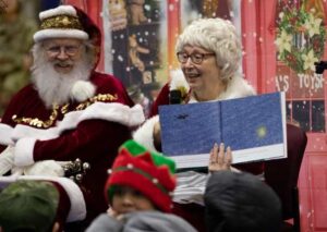 Mrs. Claus reads to the children of Yakutat in their school gymnasium as part of Operation Santa Claus in Yakutat. (Alaska National Guard photo by Staff Sgt. Seth LaCount)