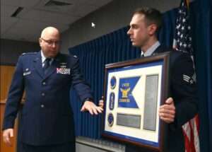 176th Wing Communication Squadron commander, Lt. Col. Herbert Gladwill, addresses his squadron and guests during the unit's redesignation ceremony March 3, 2024, at Joint Base Elmendorf-Richardson, Alaska. Communication Airmen provide various communication services to support military operations including cyber operations, deployable communications, network operations, and information technology (IT) support among others. This change from flight to squadron not only represents a name change, it encompasses the true mission that the 176th Communication Squadron fulfills.