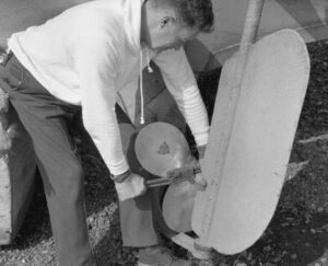 Photo: Norman Smith works on the prop of the Evangel, Larsen Bay, ca. 1955. Courtesy of Tim and Norman Smith
