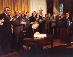 Photo courtesy of the Jimmy Carter Presidential Library President Jimmy Carter signs the Alaska National Interest Lands Conservation Act on Dec. 2, 1980.