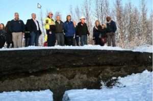 Senators Murkowski and Dan Sullivan standing at the edge of the severely damaged Vine Road in Wasilla following the 7.0 earthquake that struck a few miles north of Anchorage, Alaska in 2018.