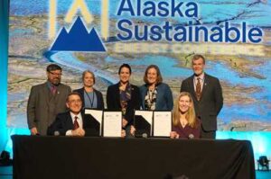 Photo courtesy of National Laboratory of the Rockies
Jud Virden, director of the DOE's National Laboratory of the Rockies and Laura Conner, UAF's vice chancellor for research, pose with a newly signed MOU. Standing behind them are, left to right: Michael McEleney, acting director for DOE's Arctic Energy Office; Lee Ann Munk, director, UAF Alaska Critical Minerals Collaborative; Audrey Robertson, assistant secretary of energy, Office of Critical Minerals and Energy Innovation; Christi Bell, strategy and innovation officer, UAF Alaska Critical Minerals Collaborative; Jeremy Kasper, director, UAF Alaska Center for Energy and Power.