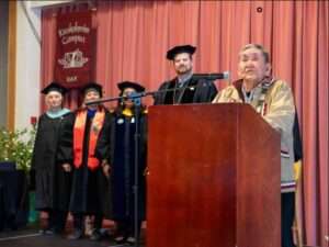 Photo by Suzi Tanski
Chief Ignatius “Louie” Andrew, traditional chief of Orutsararmiut Traditional Native Council, delivered the invocation and closing remarks at the 2024 Kuskokwim Campus commencement. Chief Andrew was a member of the first graduating class and is pictured in the photo from 1975.