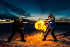 UAF photo by Todd Paris
UAF professor Katey Walter Anthony and a research technician set fire to escaping methane gas trapped beneath a frozen pond near the UAF campus in an earlier study in February 2016.