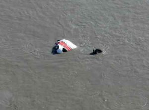 Poelman's Cessna 207 submerged at Big Susitna crashsite. Image-AST