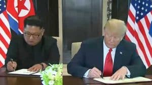 North Korean leader Kim Jong Un and President Trump signing agreement in Singapore.