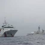 The crew of the USCGC Alex Haley (WMEC 39) transfers custody of the detained fishing vessel Run Da to a People's Republic of China Coast Guard patrol vessel in the Sea of Japan, June 21, 2018. The Alex Haley and PRC Coast Guard crews detained the Run Da suspected of illegal high seas drift net fishing. U.S. Coast Guard photo.